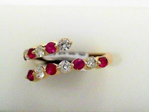 Lady's Yellow 14 Karat Contemporary By Pass Fashion Ring Size 6.5 7 = 0.42tw Round Red Rubys
7 = 0.37tw Round G/H SI1 Diamonds