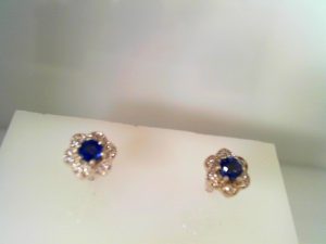 Lady's White 14 Karat Stud Earrings With One 0.46Ct Round Sapphire And 24=0.08Tw Round Diamonds