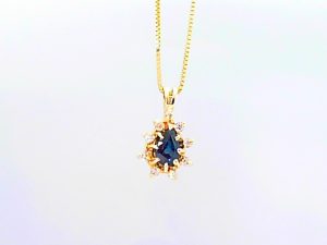Lady's Yellow 14 Karat Drop Pendants Length 18 With One Pear Greenish Blue Sapphire And 9= Round Diamonds Style: Box
Metal: 14 Karat
Color: Yellow
Finish: Polished