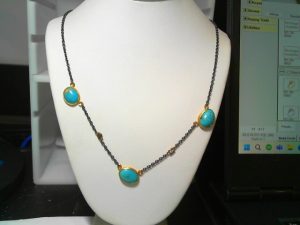 Lady's Two Tone 24K & Oxy .925 3 Stone Necklace Length 18 With 3=7.75Tw Various Shapes Turquoises And 0.06Tw Round Diamonds Chain: Cable Link
Metal: 24K & oxy .925
Color: Two Tone
Length: 18
Clasp: lobster