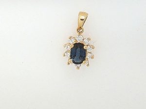 Lady's Fashion Ring With One = Oval Blue Sapphire And 10 = Round Diamonds