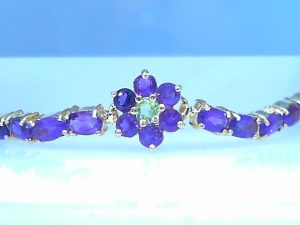 Lady's Yellow 14 Karat Tennis Bracelet Length 7 With Various Shapes Amethysts
