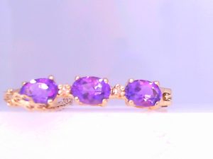 Lady's Yellow 14 Karat Cable Link Bracelet Length 7 With 3= Oval Amethysts And 2= Round Diamonds