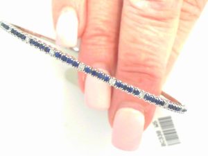GEMMA COUTURE Lady's White 14 Karat Halfway Blue Sapphire And Natural Diamond Flexible Bracelet Bracelet 10 = 0.15tw Round G VS2 Diamonds
40 = 0.72tw Round Blue Sapphires