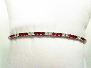 Lady's Yellow 14 Karat Flex Bangle  alternating 2 Diamond /3 Ruby Bracelet 126= 0.67tw Round G/H SI2 Diamonds
21 = 1.00tw Round Red Rubys