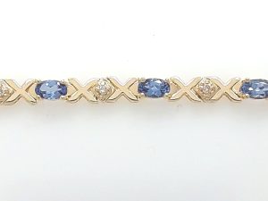 Lady's Yellow 14 Karat Fancy Link Bracelet Length 7 With 11 = Oval Bluish Purple Tanzanites And 12 = Round F/G Si1 Diamonds