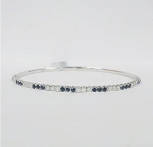 Lady's White 14 Karat Flex Bangle Bracelet 19 = 1.23tw Round Blue Strong Sapphires
17 = 0.76tw Round G/H SI2 Diamonds
