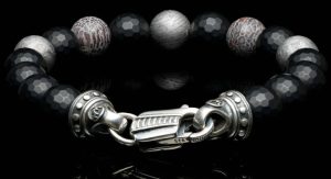 Sterling Silver Nocturn Beaded Bracelet Bracelet
 Length 8.5

STONES: Dinosaur bone, Meteorite, and Onyx
 14 = Round Black Strong Onyxs 
2 = Dinosaur bone
3= Meteorite 

 Blends dinosaur bone and Gibeon meteorite beads with matte faceted black onyx for a refined contrast of texture and tone. Finished with a custom clasp