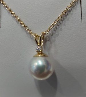 Yellow 14 Karat  Length  15-18 one inches with one  8.00mm Cultured Pearl and 
one 0.02ct Round Diamond set in the bail