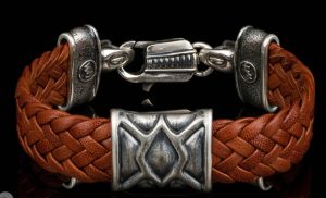 Kangaroo Brown Leather hand crafted with Sterling Silver Accents

Bracelet width 15MM

The ‘Rhomb’ leather bracelet features rich, widely woven kangaroo leather adorned with textured and patinated sterling silver details, offering a depth of appearance that is uniquely William Henry.