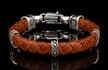 The ‘Norn’ leather bracelet features rich, braided lambskin leather adorned with textured and patinated sterling silver details, offering a depth of appearance that is uniquely William Henry. This handcrafted piece radiates character with an unmistakablelook and feel, born from uncompromising artistry.