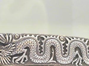 PRODUCT DETAILS
The Gentac ‘Silver Dragon’ features an intricate frame in hand-carved sterling silver by Lee Downey. The blade is hand-forged 'Intrepid' damascus by Chad Nichols. The one-hand button lock and the thumb stud are set with lapis lazuli gemstones. An exceptional design that offers rigorous performance in a sleek, comfortable knife, the Gentac is also the perfect canvas to showcase William Henry’s range of exotic materials and techniques. The ‘Silver Dragon’ features some of the unique materials, artistry, and metals that are the hallmark of William Henry's collections.

B30 SILVER DRAGON

MATERIALS
Carved Sterling Silver
Hand-forged damascus
Lapis Lazuli
FEATURES & SPECS
One-hand button lock system
Leather carrying case
Shipped in an elegant wood presentation box
Dimensions: 
Blade 3.25" (82.5mm)
Handle 3.80" (96.5mm)
Overall open 7.00" (177.8mm)