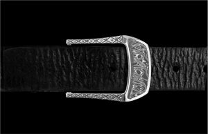 This beautiful belt buckle works from the street to the boardroom, and it creates an elegant accent to any attire. Sculpted in solid sterling silver, the highlight is a striking inlay of hand-forged stainless Damascus steel (our Intrepid pattern). 140 layers of three different alloys forged into one tapestry in steel, heat treated, etched and polished to reveal the unique pattern as the alloys dance together. Fits any 1.25” (1 and ¼” wide) belt that allows for interchanging buckles.