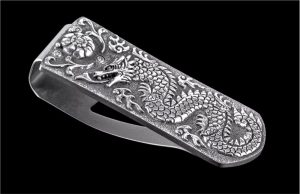 The Zurich ‘Naga' features an exquisite hand-carved sterling silver dragon and Peyote button by Lee Downey. The stunning artistry celebrates the Year of the Dragon. The clip is machined and polished from tempered stainless steel, with a beautiful engraving bright cut against the matte-finished background. The ‘Naga’ money clip is a beautiful and functional personality statement featuring some of the unique materials and forged metals that are the hallmark of William Henry's collections; a timeless heirloom to be proudly worn and used for a lifetime before handing it down to another generation.

Product SKU: M3 NAGA

MATERIALS
Carved Sterling Silver
FEATURES & SPECS
Mechanism: tension
Engraved serial number