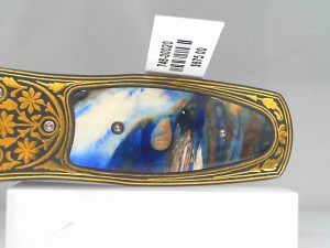 PRODUCT DETAILS
The Pharaoh 'Cobalt' features a frame in 24K gold koftgari (the ancient Indian art of inlaying gold or sterling silver in tool steel), inlaid with 10,000 year-old fossil Woolly Mammoth tooth. The clip is machined and blast-polished from tempered stainless steel, with a beautiful engraving bright cut against the matte-finished background. The Pharaoh money clip - inspired by the designs of ancient Egypt - draws on the elegant vessel forms of antiquity to create a simple yet striking range of possibilities, rendered in a variety of our hallmark materials and techniques. An elegant form with an enduring legacy.

Product SKU: M4 COBALT

MATERIALS
Fossil Mammoth tooth
Koftgari
FEATURES & SPECS
Mechanism: tension
Engraved serial number